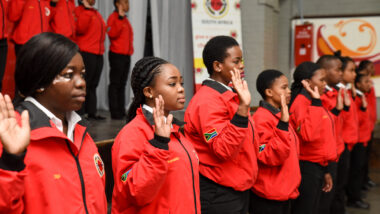 Service leaders in red jackets taking the City Year pledge
